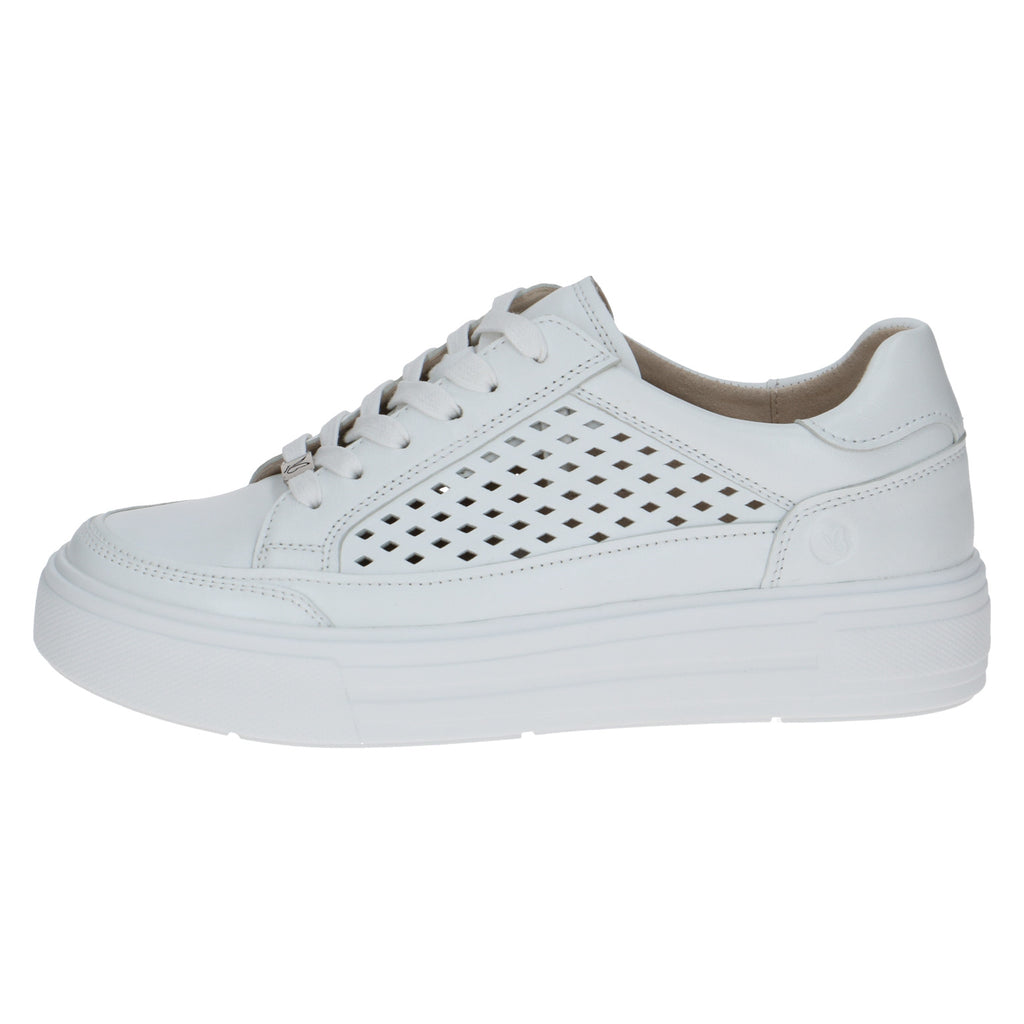 White sneaker with perforated design on a white background