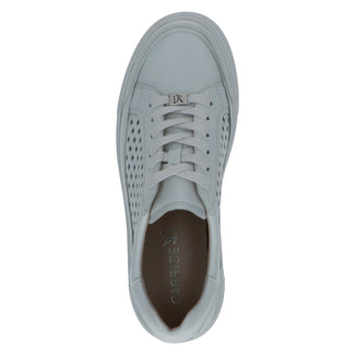 White sneaker with perforated design on a white background
