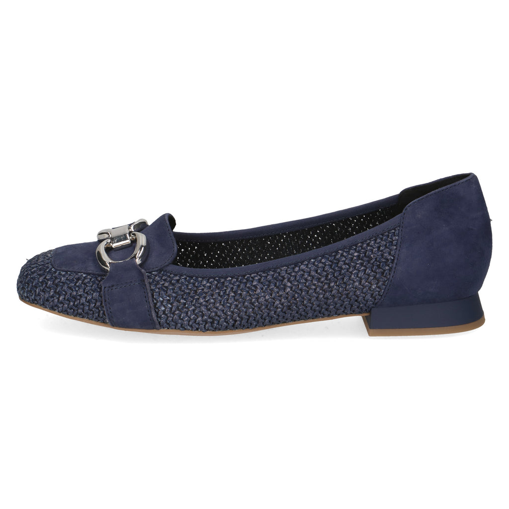 Navy blue flat shoe with textured pattern and silver buckle on a white background