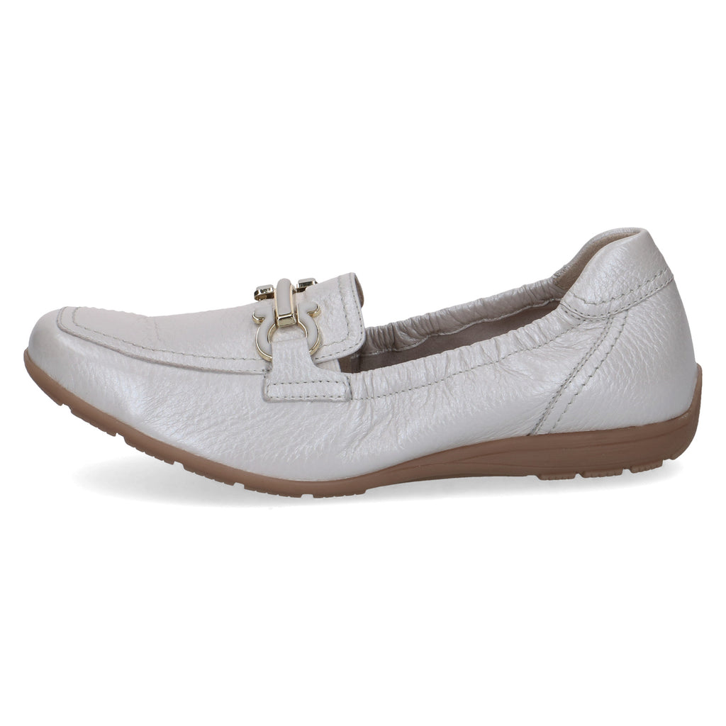White leather shoe with a brown sole on a white background