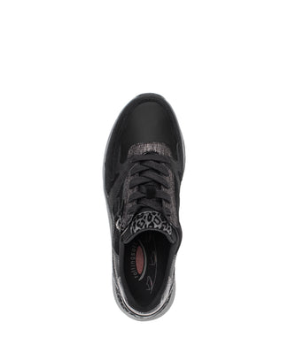 Black and gray sneaker with leopard print details on a white background