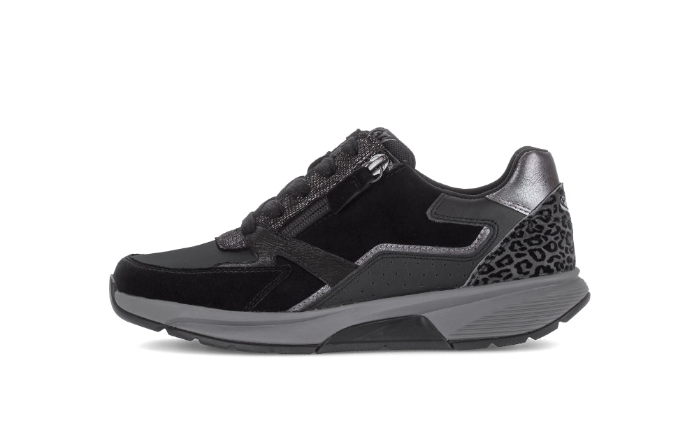 Black and gray sneaker with leopard print details on a white background