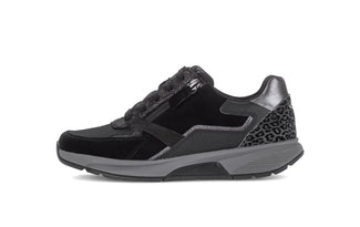 Black and gray sneaker with leopard print details on a white background
