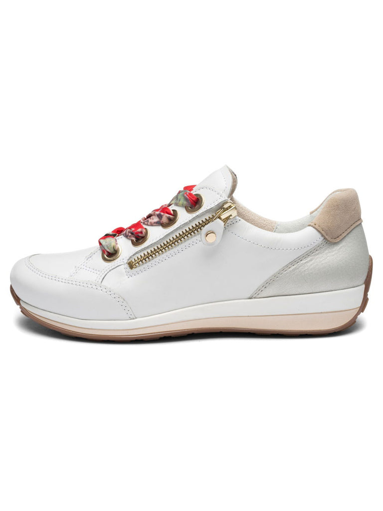 White sneaker with floral accents and a gold zipper on a white background