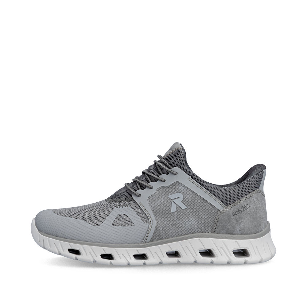 Gray athletic shoe with a brand logo on a white background