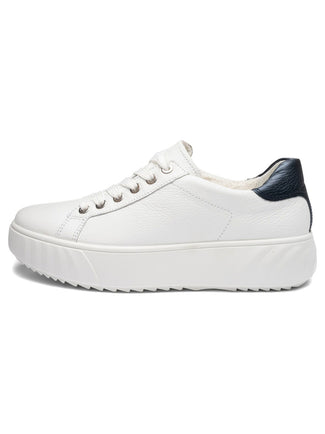 White sneaker with a black heel on a white background