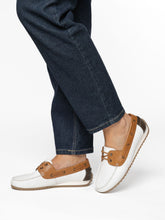 Load image into Gallery viewer, White and brown loafers worn with blue jeans on a white background
