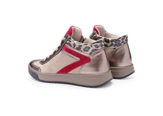 Beige sneaker with red accents on a white background