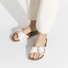 Load image into Gallery viewer, Pink sandals with metallic buckles worn by a person on a white background
