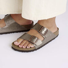 Load image into Gallery viewer, Brown sandals with buckles worn by a person on a white background

