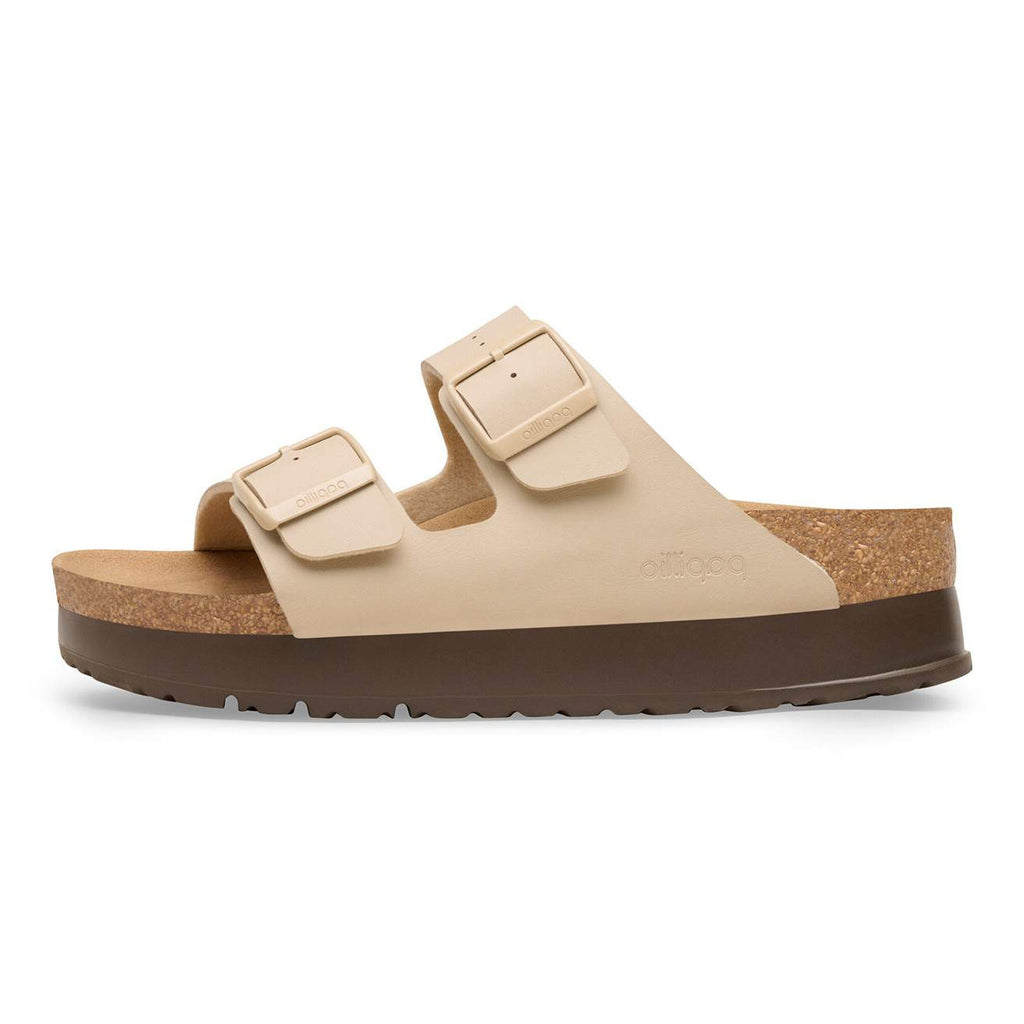 Beige sandal with cork sole on a white background