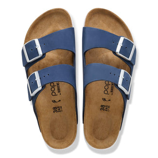 Blue sandal with cork sole on a white background