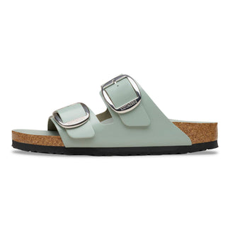 Light green sandal with cork sole on a white background