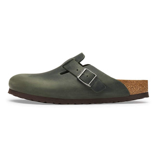 Green sandal with cork sole on a white background