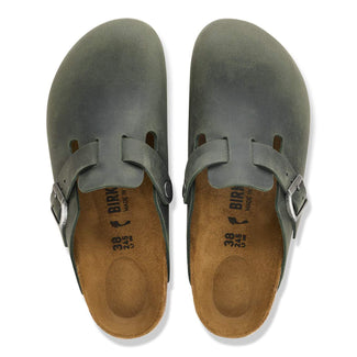 Green sandal with cork sole on a white background