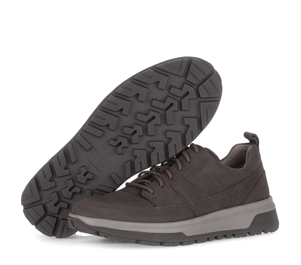 Brown sneakers with black soles on a white background