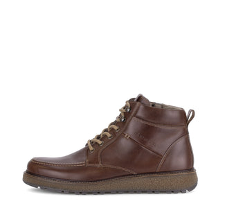 Brown leather boot on a white background