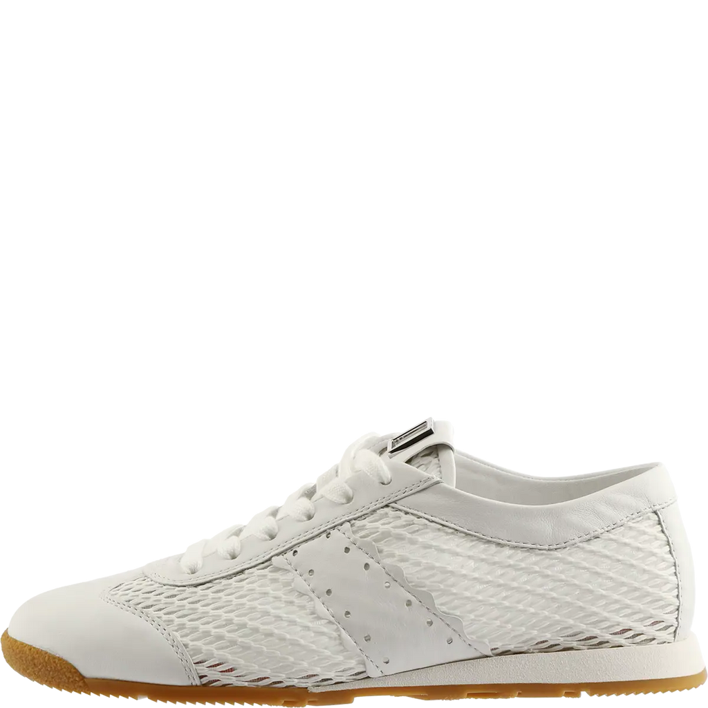 White sneaker with a textured pattern on a white background