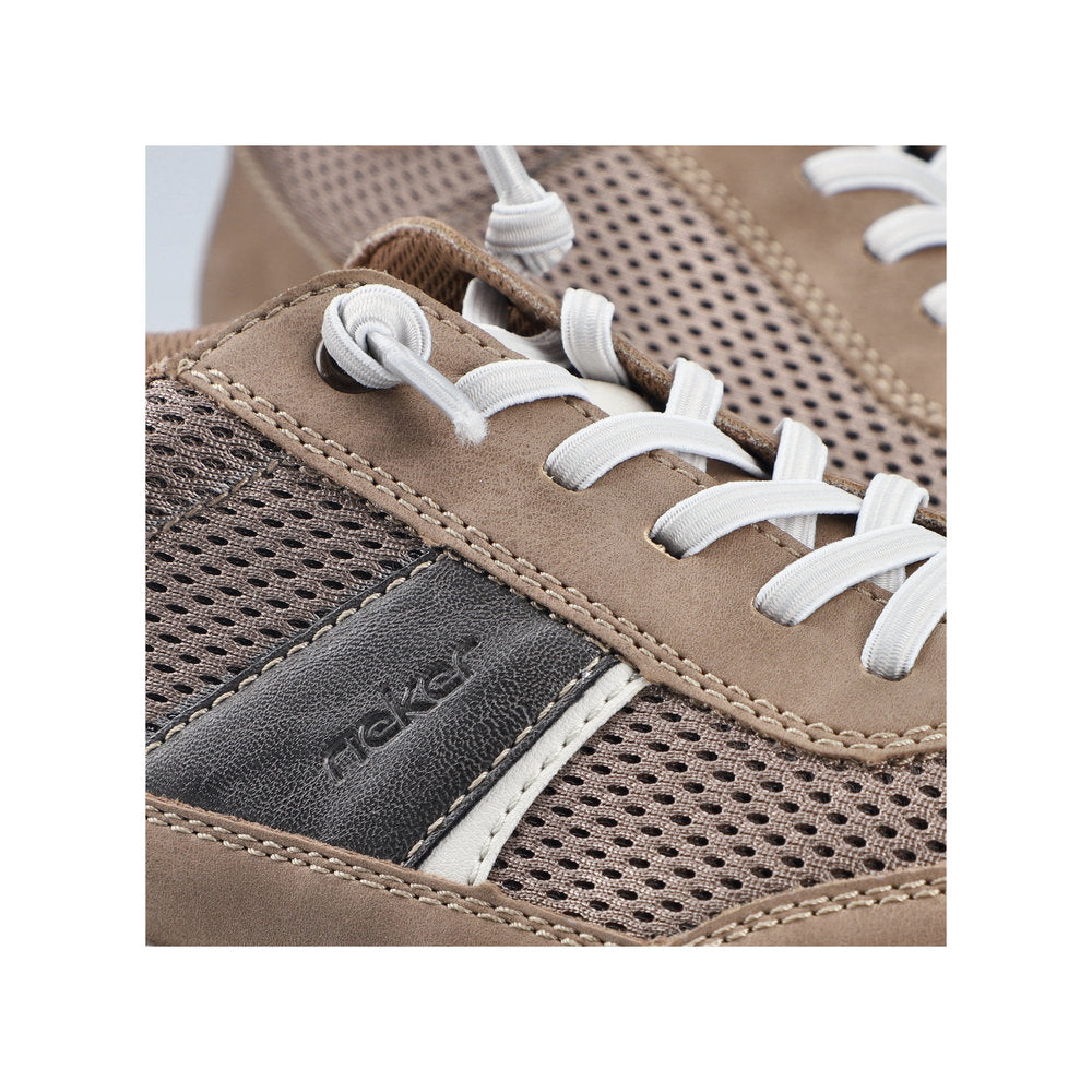 Close-up of a brown sneaker with white laces and 'Rieker' branding.