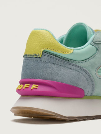 Multicolored sneaker on a light gray background
