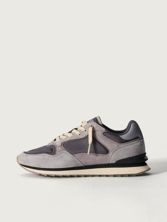 Gray and black sneaker on a light gray background