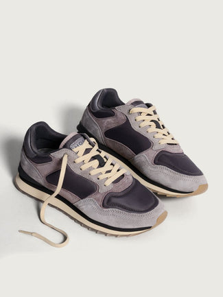 Gray and black sneaker on a light gray background