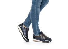 Load image into Gallery viewer, Navy blue sneakers worn with blue jeans on a white background
