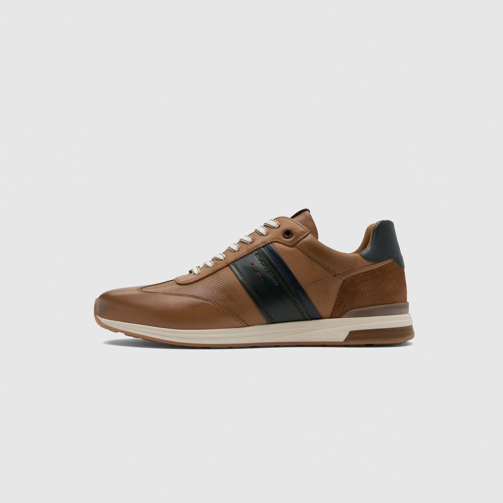 Brown sneaker with black stripe on a light gray background