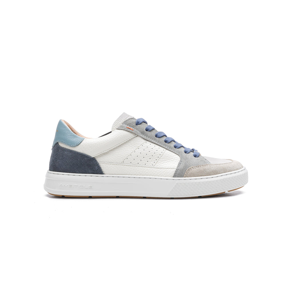 White sneaker with blue and gray accents on a white background