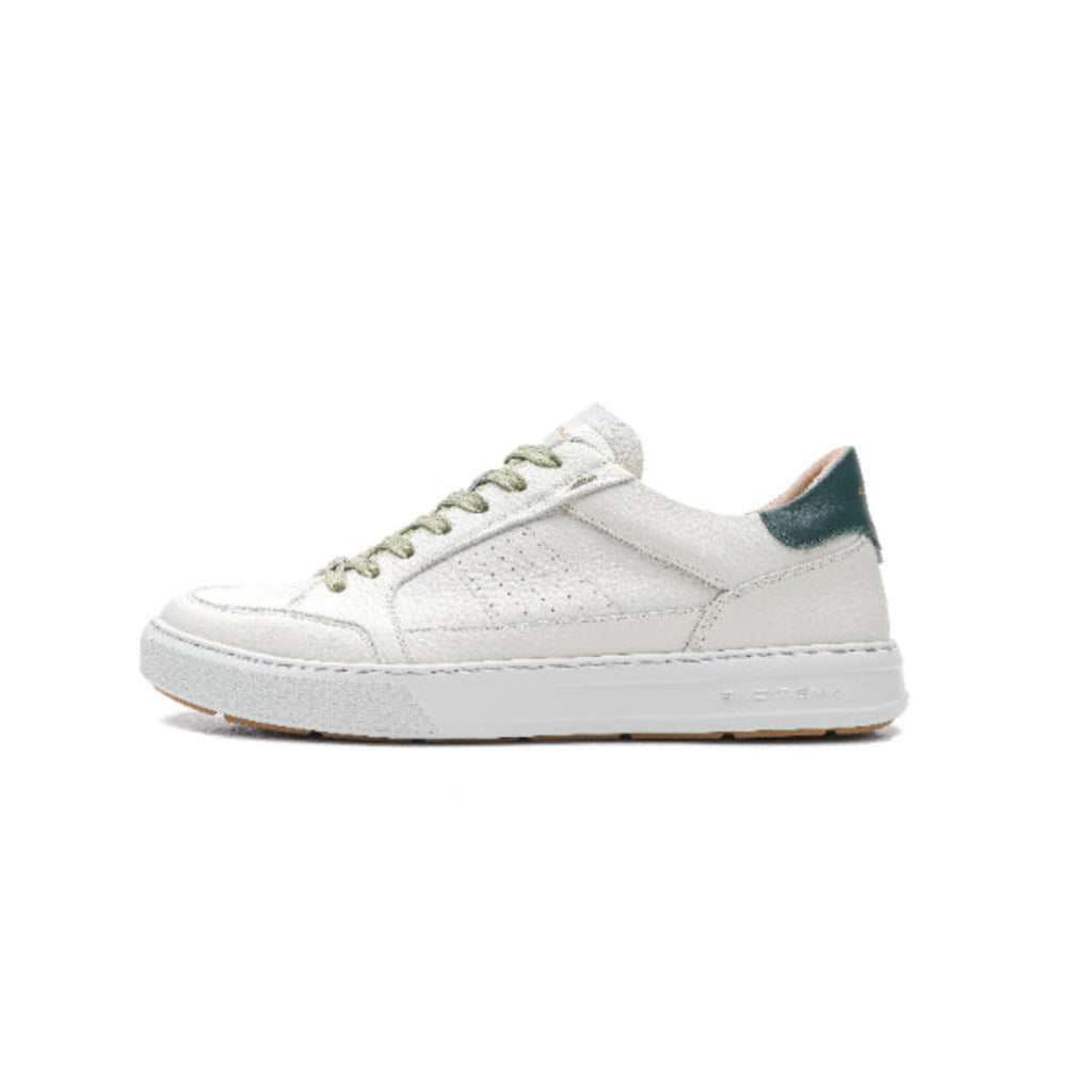 White sneaker with green accents on a white background