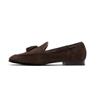 Brown suede loafer with a tassel on a white background