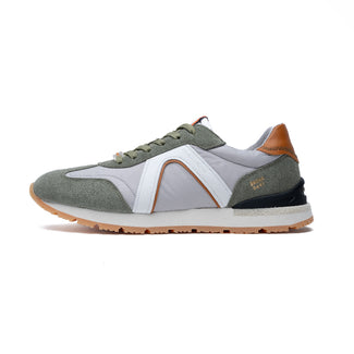 Sneaker with green, white, and brown color scheme on a white background