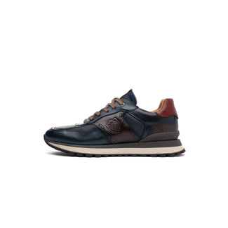 A single dark navy leather sneaker with brown accents, featuring a textured side panel, a debossed logo on the side, and a thick beige midsole, shown in profile against a white background.