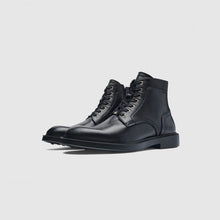 Load image into Gallery viewer, A pair of black leather lace-up ankle boots with a low block heel, shown from a side profile on a light gray background.
