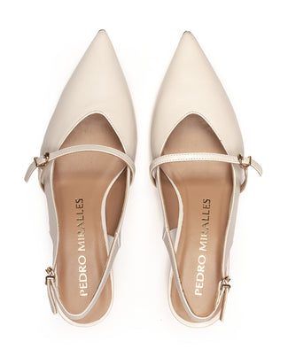 Beige slingback shoe on a white background