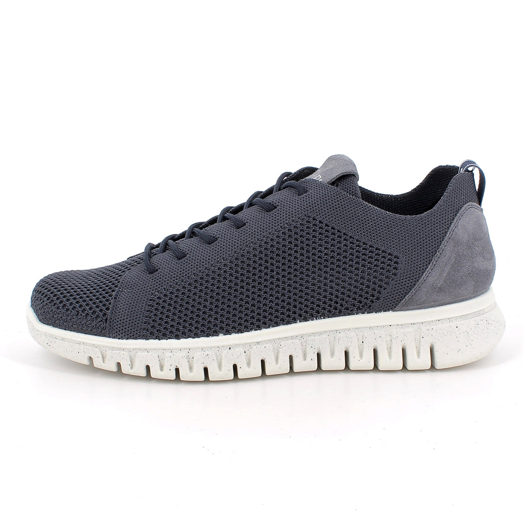 navy sneaker with white sole on a white background
