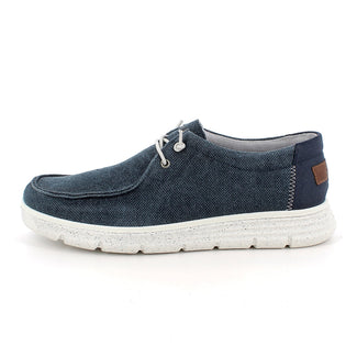 Blue casual shoe with white sole on a white background