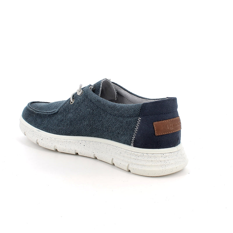 Blue casual shoe with white sole on a white background