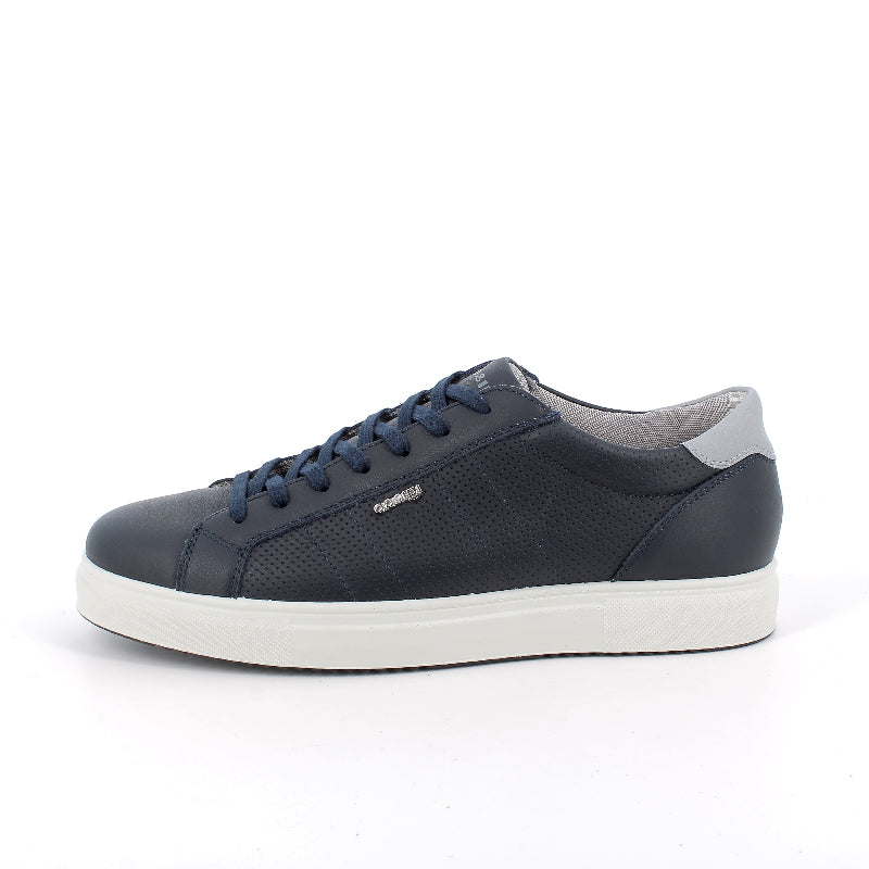 Navy blue sneaker with white sole on a white background