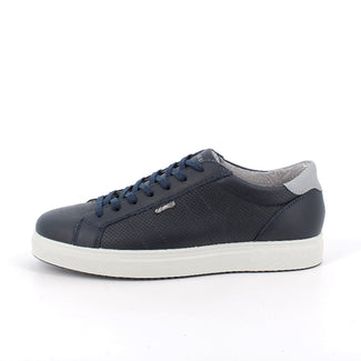 Navy blue sneaker with white sole on a white background