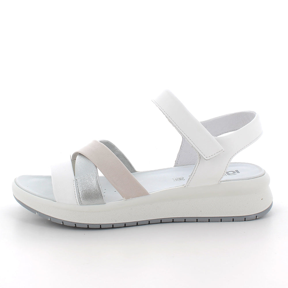 White sandal with a strap on a white background