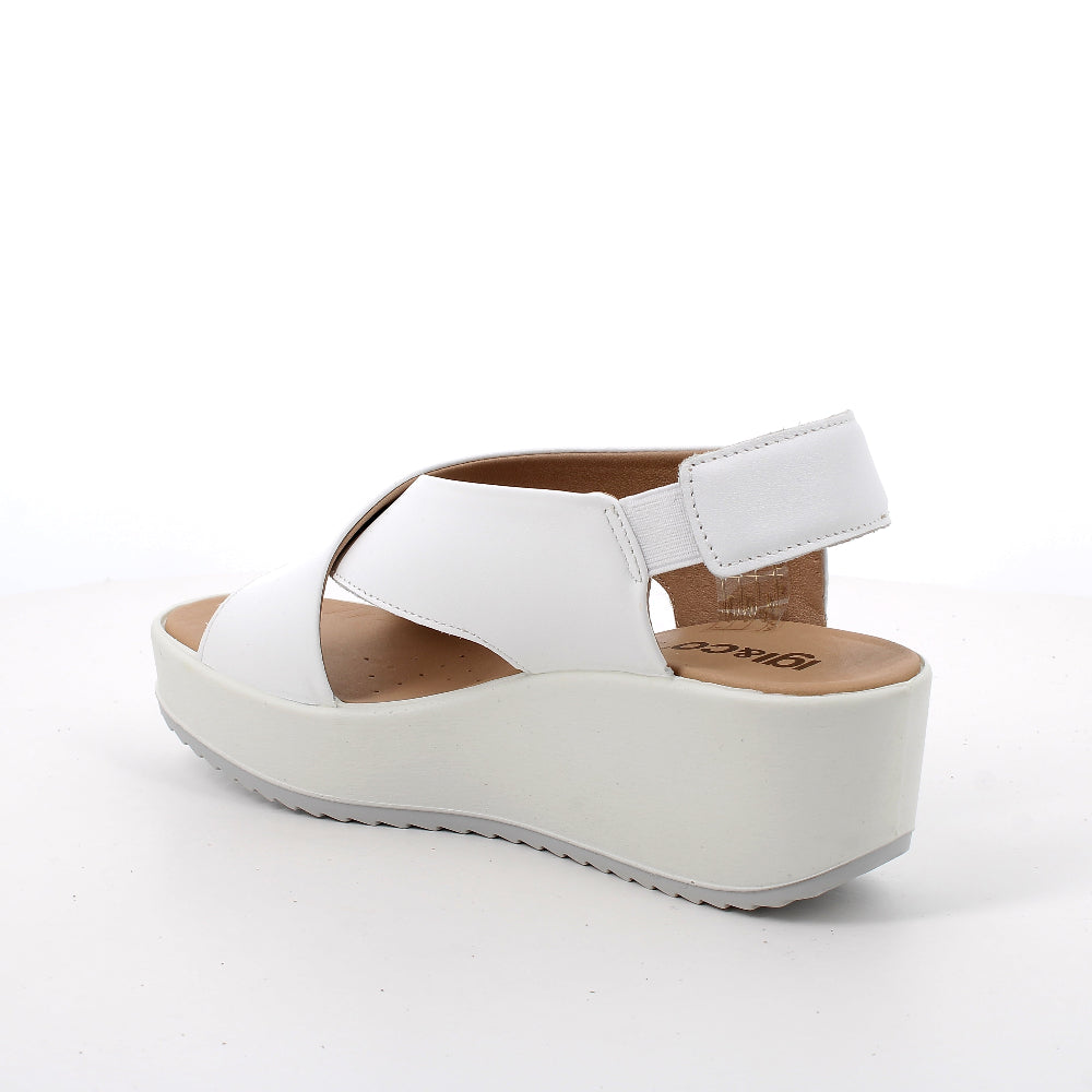 White sandal with a platform sole on a white background