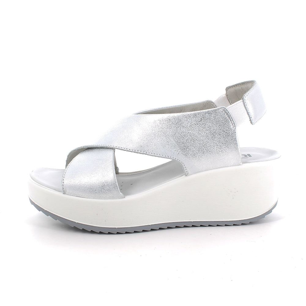 Silver sandal with a platform sole on a white background