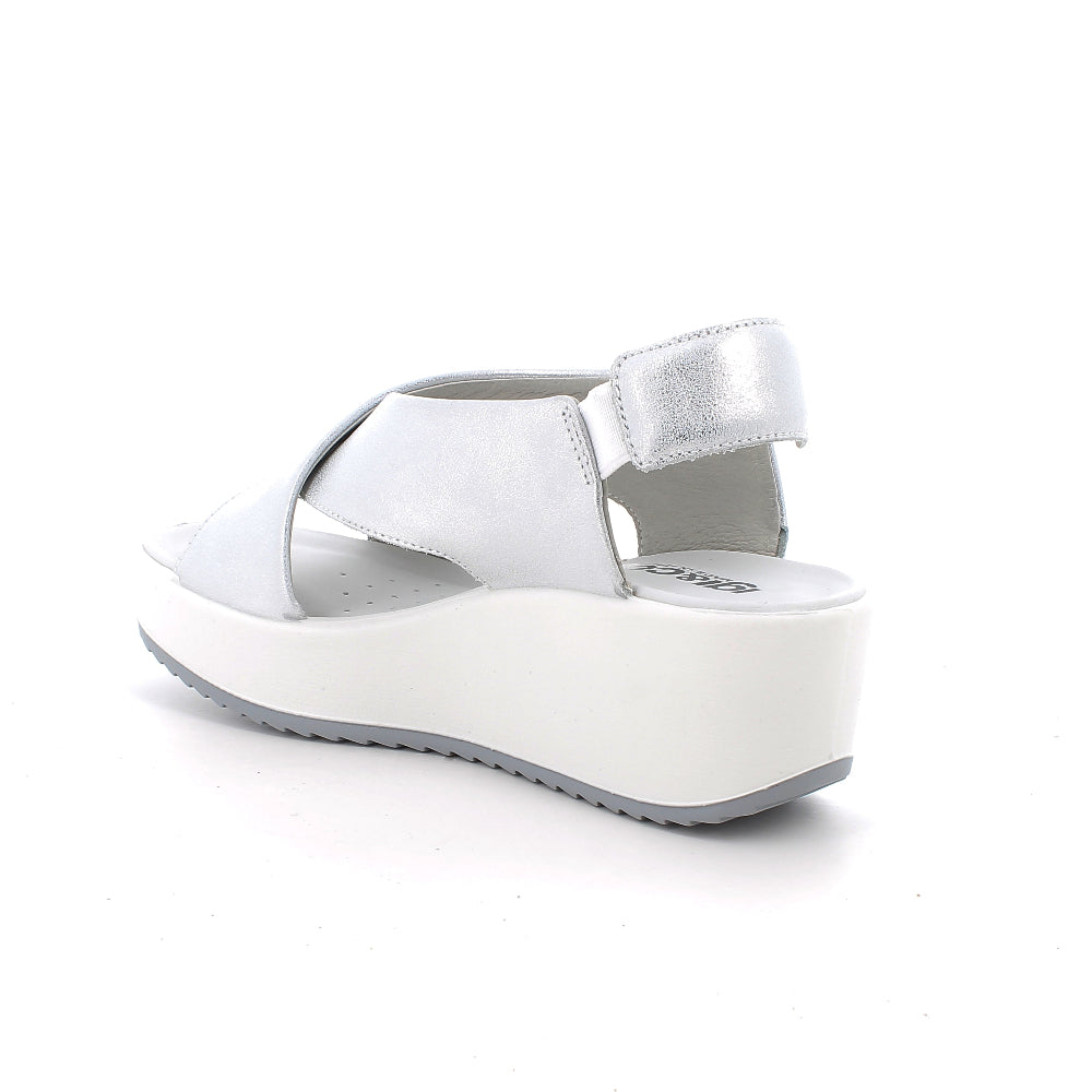 White sandal with a platform sole on a white background