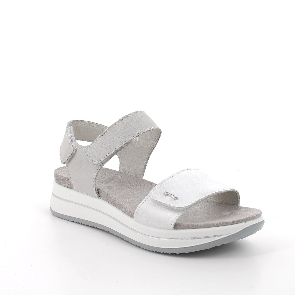 White sandal with gray straps on a white background