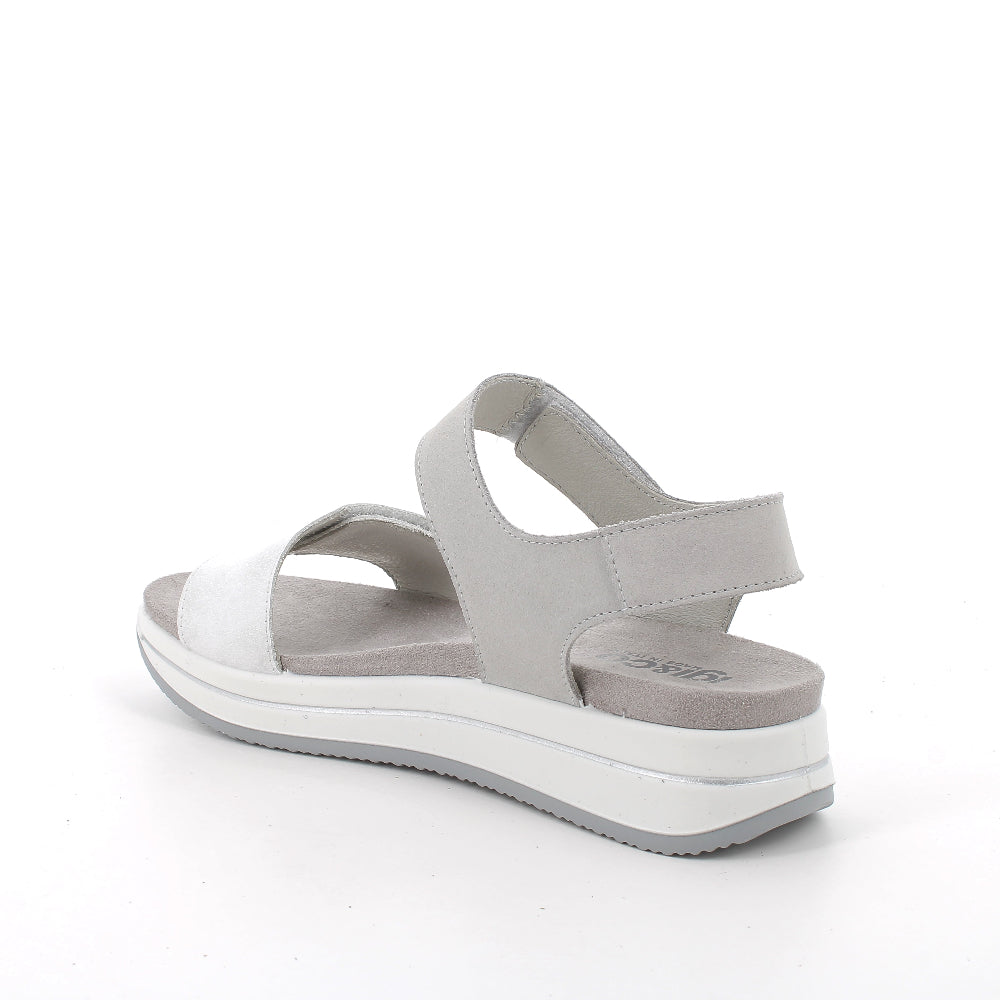 White sandal with gray straps on a white background