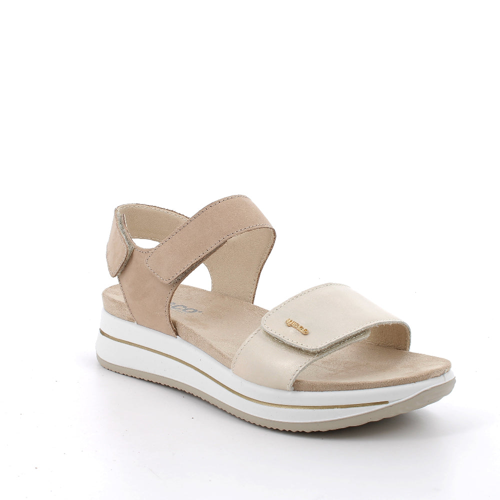 Beige sandal with white sole on a white background
