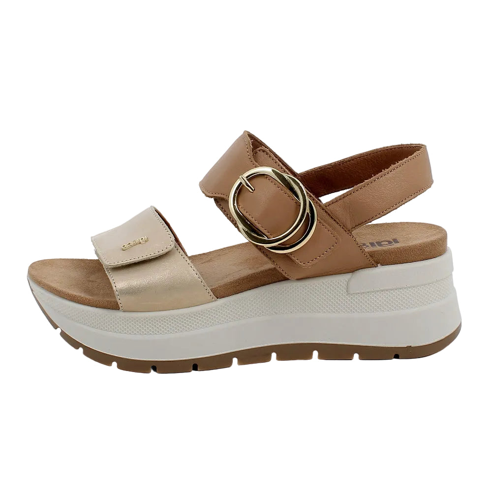 Tan and white sandal with a gold buckle on a white background