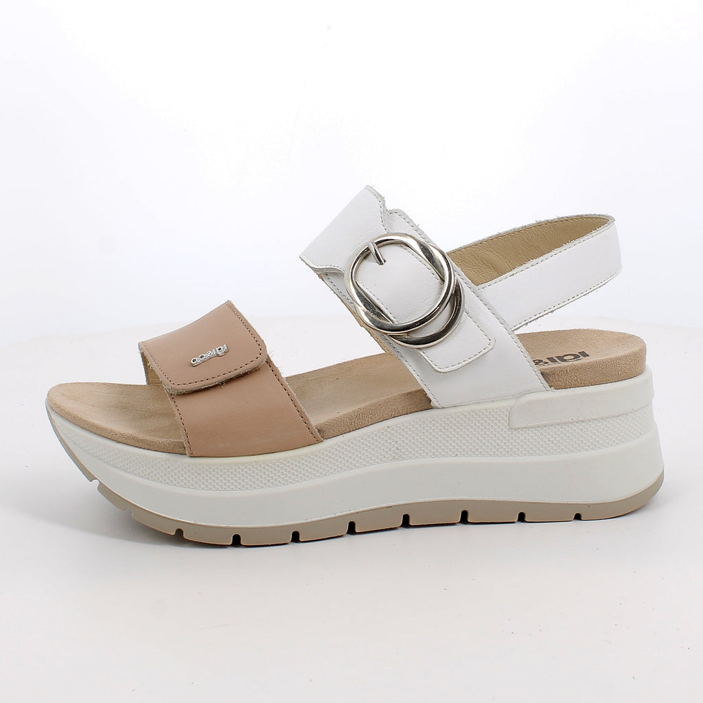 White and beige sandal with a platform sole on a white background