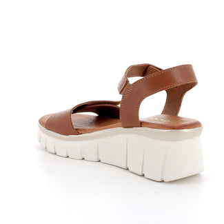 Brown sandal with white sole on a white background